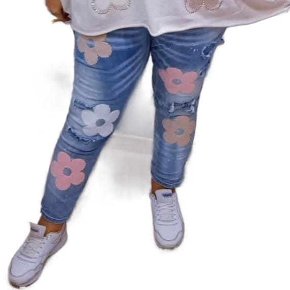 Jeansbroek met bloemen.
